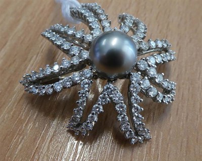 Lot 163 - ^ A Cultured Pearl and Diamond 'Fireworks' Brooch, by Tiffany, a grey cultured pearl within a round