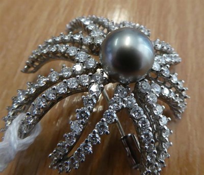 Lot 163 - ^ A Cultured Pearl and Diamond 'Fireworks' Brooch, by Tiffany, a grey cultured pearl within a round