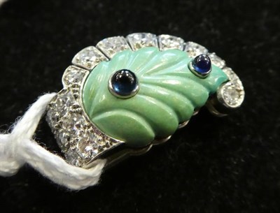 Lot 170 - ^ A Turquoise, Sapphire and Diamond Clip Brooch, by Cartier, a carved turquoise leaf set with...