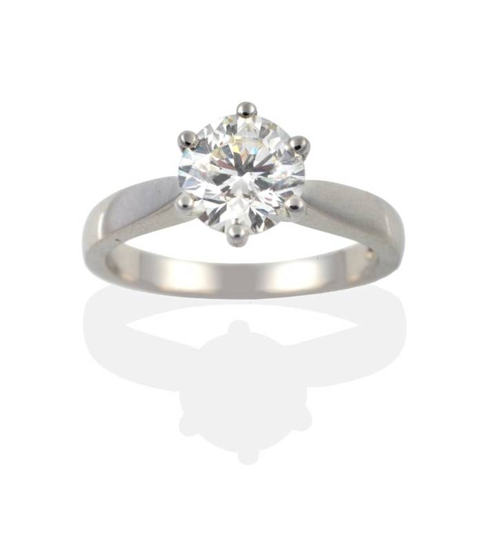 Lot 172 - A Platinum Diamond Solitaire Ring, the round brilliant cut diamond in a six claw setting to pointed