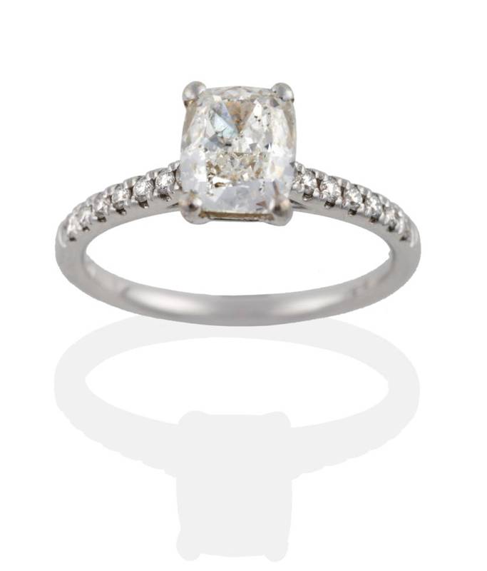 Lot 199 - An 18 Carat White Gold Diamond Ring, the brilliant cushion cut diamond, in a four claw setting,...