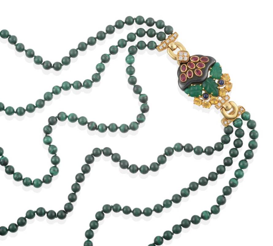 Lot 210 - ^ A Triple Strand Malachite Bead Necklace, with a Multi-Gemstone Set Clasp, by Cartier, uniform...