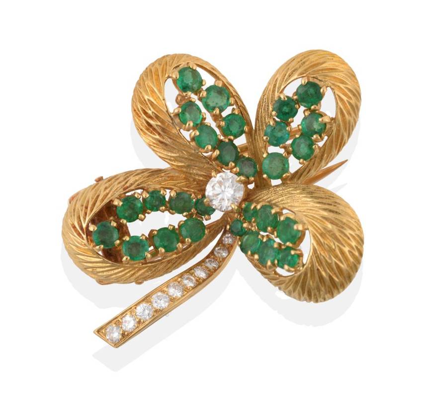 Lot 211 - ^ An Emerald and Diamond Novelty Four Leaf Clover Brooch, by Cartier, a central round brilliant cut