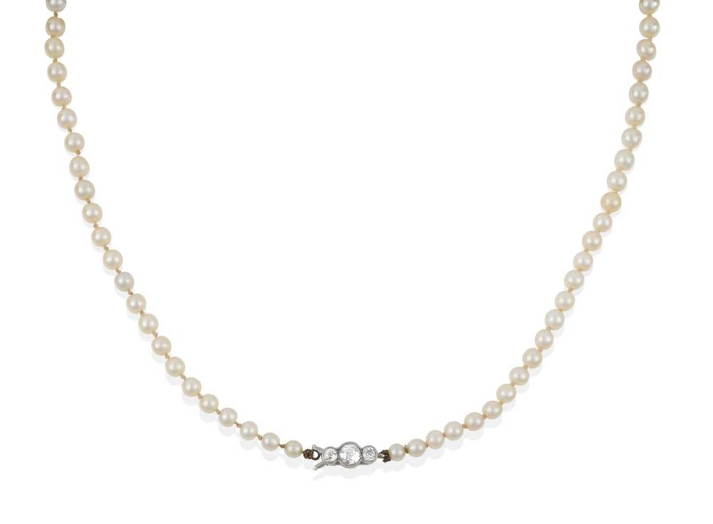 Lot 213 - A Pearl Necklace with Diamond Snap, the eighty-five pearls knotted to a clasp of three old cut...