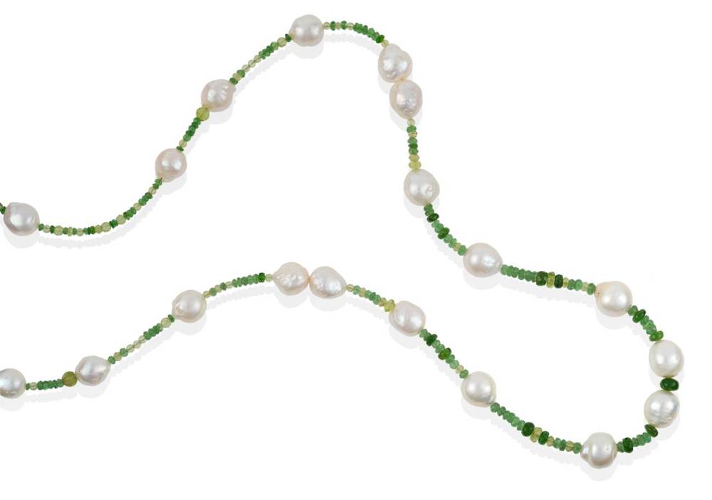 Lot 220 - A Peridot, Chrome Diopside, Tsavorite Garnet and Cultured Pearl Necklace, faceted peridot...