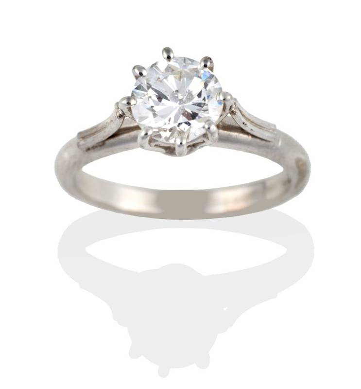 Lot 222 - A Diamond Solitaire Ring, the round brilliant cut diamond in a white eight claw setting, to...