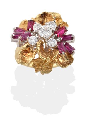 Lot 228 - An 18 Carat Gold Ruby and Diamond Cocktail Ring, set with five round brilliant cut diamonds and...