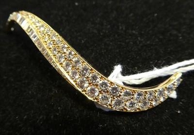 Lot 234 - ^ A Diamond 'Flamme' Brooch, by Van Cleef & Arpels, a scroll pavé set with graduated round...