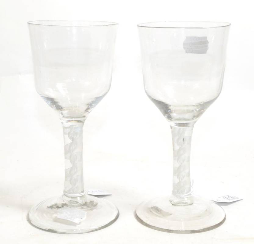 Lot 502 - A Pair of Glass Goblets, circa 1750, the ogee bowls on double series opaque twist stems and...