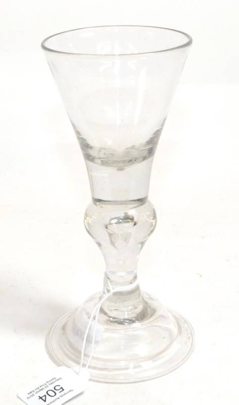 Lot 504 - A Baluster Wine Glass, circa 1730, the conical bowl on a baluster stem with air tear and domed...