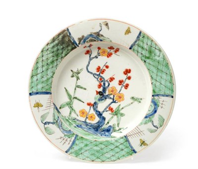 Lot 506 - An Early Worcester Porcelain Plate, circa 1752, painted in famille verte style with a bird...