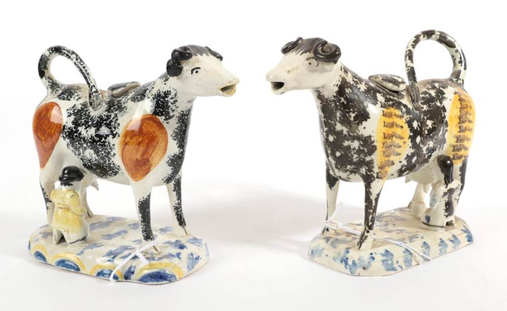 Lot 522 - A Matched Pair of Pearlware Cow Creamers and Stoppers, circa 1820, the standing beasts with...