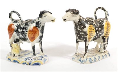 Lot 522 - A Matched Pair of Pearlware Cow Creamers and Stoppers, circa 1820, the standing beasts with...