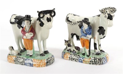 Lot 523 - A Yorkshire Pratt Type Pottery Cow Group, circa 1810, the standing beast with black markings, a...