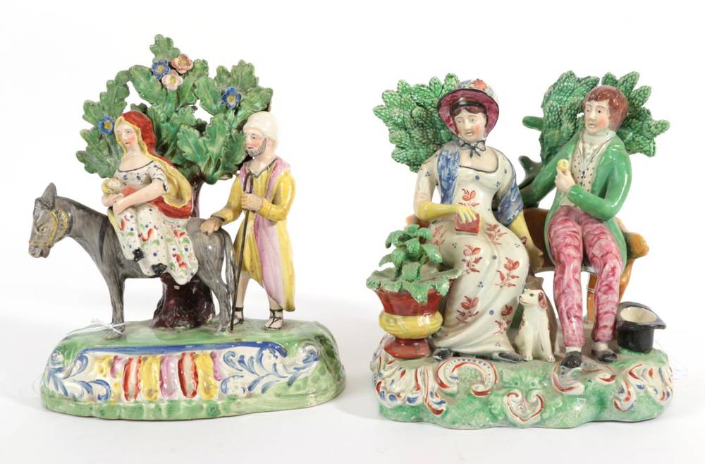 Lot 526 - A Walton Type Pearlware Flight into Egypt Group, circa 1820, the Holy Family with a donkey...