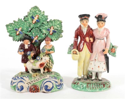 Lot 527 - A Staffordshire Pearlware Figure Group of The Dandies, circa 1820, the fashionable couple...