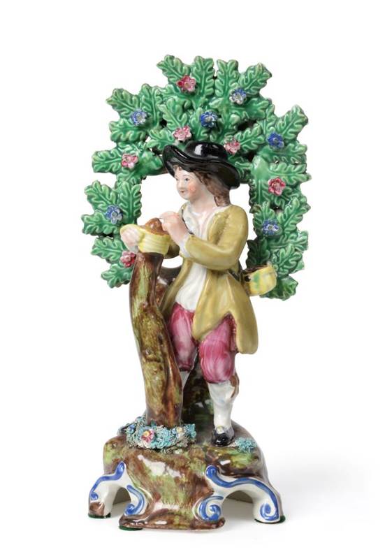 Lot 528 - A Staffordshire Pearlware Figure of a Tree Grafter, possibly Walton, circa 1820, the standing...