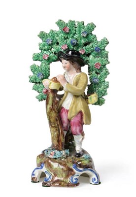 Lot 528 - A Staffordshire Pearlware Figure of a Tree Grafter, possibly Walton, circa 1820, the standing...