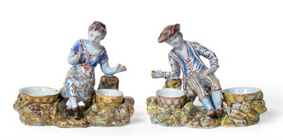 Lot 535 - A Pair of Dutch Delft Figural Salts, late 18th/early 19th century, as a man and woman in...