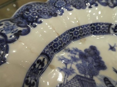 Lot 558 - A Chinese Porcelain Dish, Qianlong, of fluted circular form, painted in underglaze blue with a...