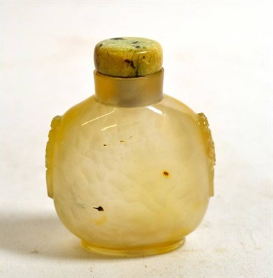 Lot 568 - A Chinese Agate Snuff Bottle, 19th century, of flattened ovoid form with mask and ring handles,...