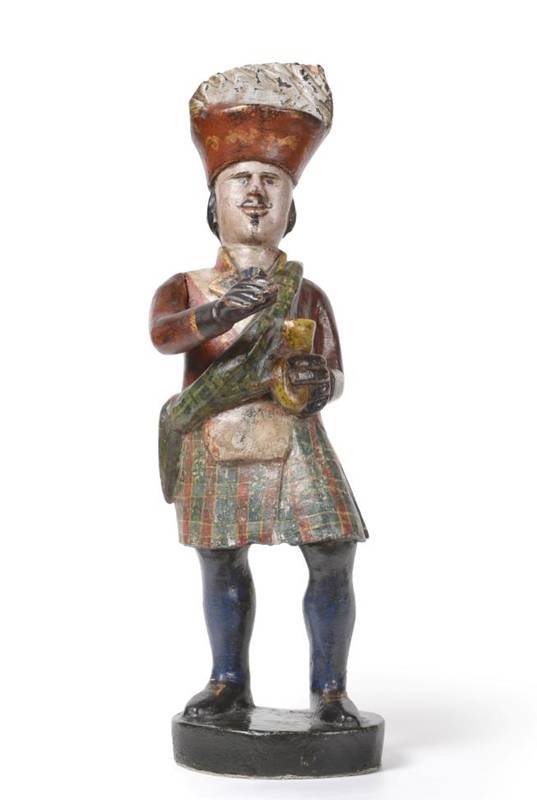 Lot 583 - A Carved and Painted Wood Tobacconist Advertising Figure, 19th century, modelled as a Highlander in