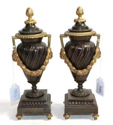 Lot 588 - ~ A Pair of French Gilt and Patinated Bronze Cassolettes, in Louis XVI style of wrythen...