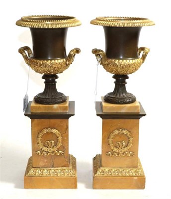 Lot 590 - ~ A Pair of French Gilt and Patinated Campana Vases, mid-19th century, on square section Sienna...