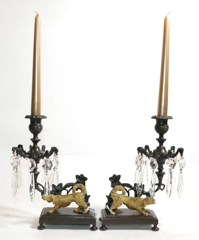 Lot 591 - ~ A Pair of French Gilt and Patinated Bronze Candlesticks, late 19th century, hung with glass...