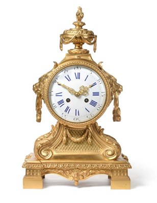 Lot 631 - An Ormolu Striking Mantel Clock, circa 1890, urn finial and lion mask side carrying handles,...