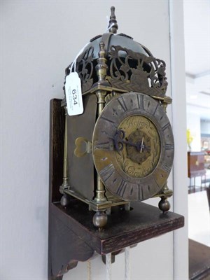 Lot 634 - A Small Brass Lantern Form Hook and Spike Alarm Wall Timepiece, signed Kefford, Royston, circa...
