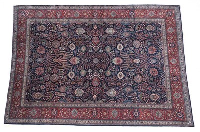 Lot 649 - ^ Carpet of Saroukh design, circa 1960 The deep indigo field with an allover design of...