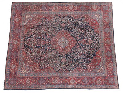 Lot 650 - Kashan Carpet of unusual size Central Iran, circa 1930 The deep indigo field of scrolling vines...