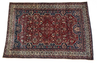 Lot 651 - Feraghan Saroukh Carpet West Iran, circa 1925 The blood red field of palmettes and vines...