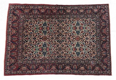 Lot 653 - Isfahan Rug Central Iran, circa 1950 The ivory lattice field of semi-naturalistic flowers...
