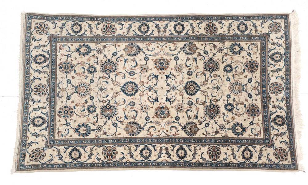 Lot 654 - Kashan Rug Central Iran, circa 1960 The ivory field with an allover design of palmettes, vines...