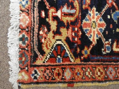 Lot 656 - Heriz Carpet of unusual size Iranian Azerbaijan, circa 1920 The madder field of angular vines...