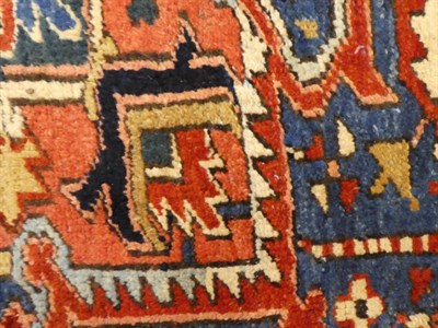 Lot 656 - Heriz Carpet of unusual size Iranian Azerbaijan, circa 1920 The madder field of angular vines...