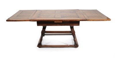 Lot 667 - An 18th Century Continental Oak Drawleaf Extending Dining Table, of rectangular form with plain...