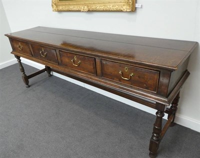 Lot 670 - An 18th Century Oak Low Dresser, the moulded top with four crossbanded frieze drawers, on...