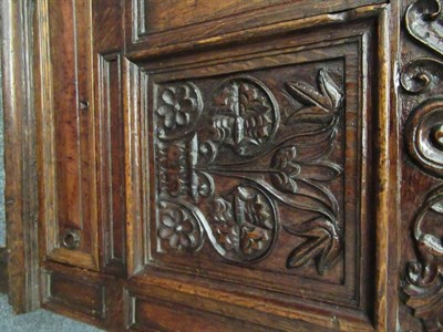 Lot 671 - A Late 17th Century Joined Oak Chest, the boarded hinged lid above a carved frieze dated 1686...