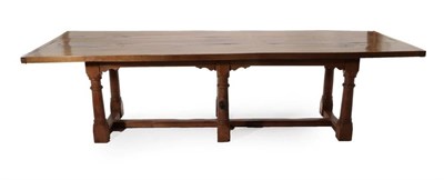 Lot 677 - A Joined Oak Dining Table, the three-plank top with cleated ends, on six gun barrel turned legs...