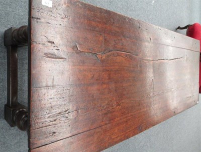 Lot 679 - A Carved Oak Refectory Table, the later top above a lunette carved frieze, on turned legs with...