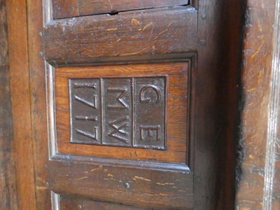 Lot 680 - An 18th Century Joined Oak Cwpwrdd Tridarn, Welsh, dated 1717 with initials GE and MW, the...