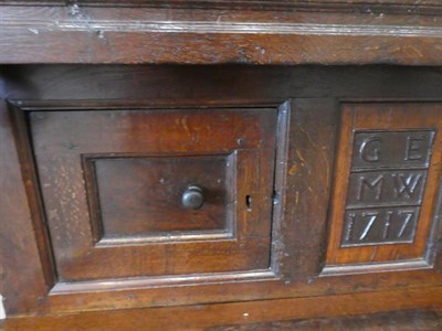 Lot 680 - An 18th Century Joined Oak Cwpwrdd Tridarn, Welsh, dated 1717 with initials GE and MW, the...
