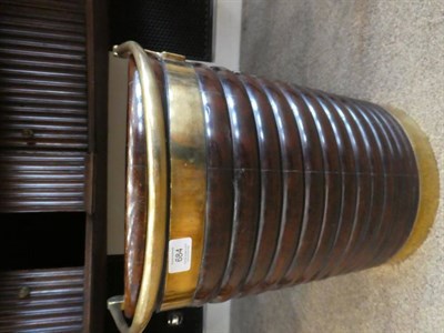Lot 684 - ^ A George III Mahogany and Brass Bound Peat Bucket, circa 1800, with pivoting brass handle and...