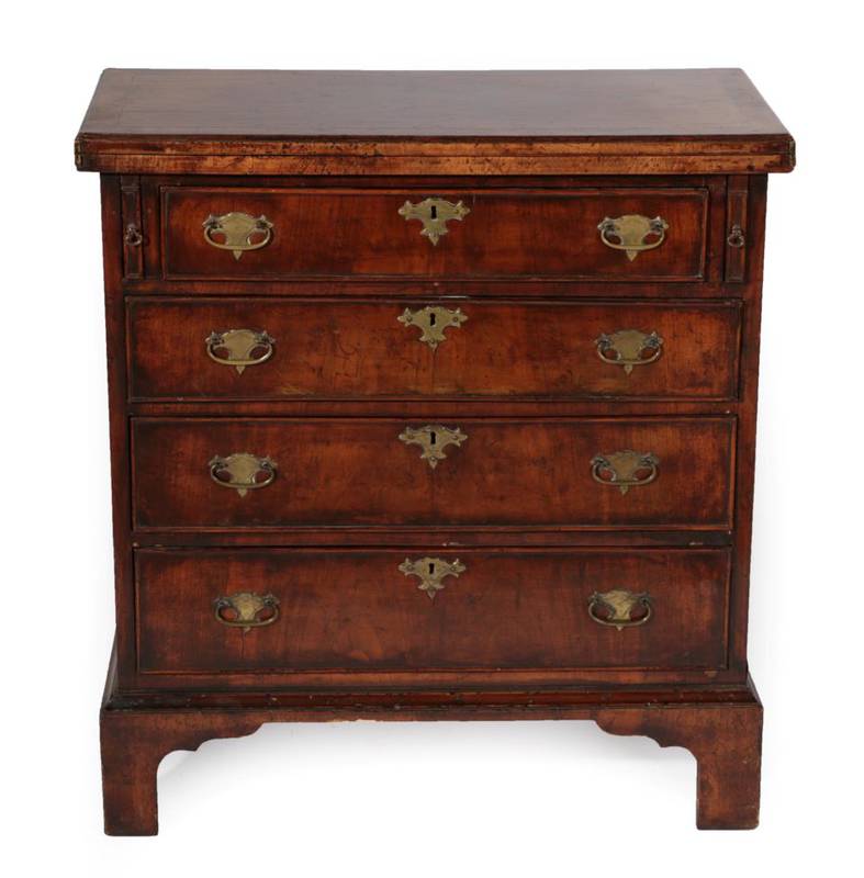 Lot - A George III mahogany bachelors chest the cross banded