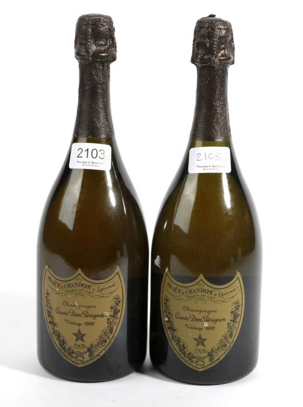 Lot 2103 - Dom Perignon 1992 2 bottles both still in bubble, scuffed labels