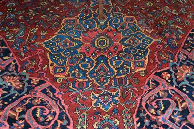 Lot 650 - Bakhtiari Carpet West Iran, Circa 1920 The madder field of angular vines around three...