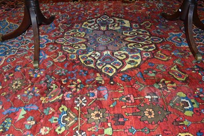 Lot 650 - Bakhtiari Carpet West Iran, Circa 1920 The madder field of angular vines around three...